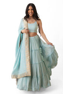 Elvia Sky Blue Shimmer Tiered Lehenga Choli Set with Gold Accents