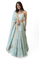 Elvia Sky Blue Shimmer Tiered Lehenga Choli Set with Gold Accents