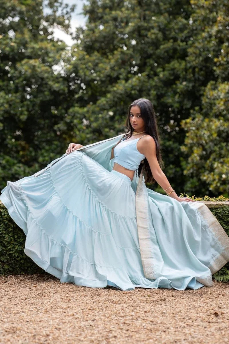 Elvia Sky Blue Shimmer Tiered Lehenga Choli Set with Gold Accents