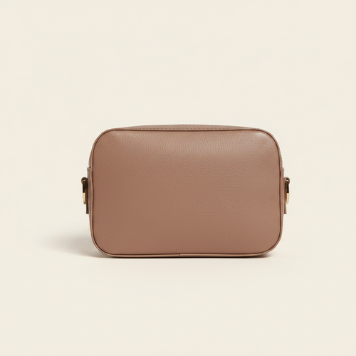 Gala Crossbody Camera Bag Dusty Rose model with natural shadow on warm ivory background