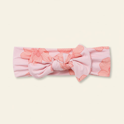 Bow Headband on clean warm ivory background, zero shadows — CULTR editorial product photo
