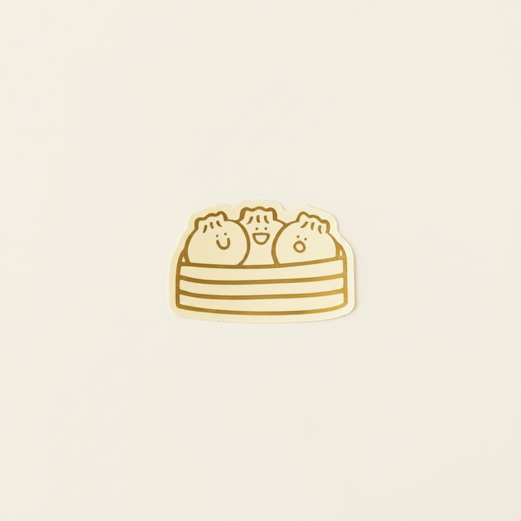 Bao Dumpling Basket Gold Foil Vinyl Sticker on clean warm ivory background with flat ambient light — CULTR editorial product photo