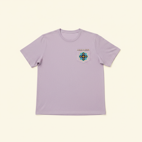 Adult Short Sleeve Pocket Tee – Purple Rangoli based on 2nd photo, clean warm ivory background, zero shadows — CULTR editorial product photo