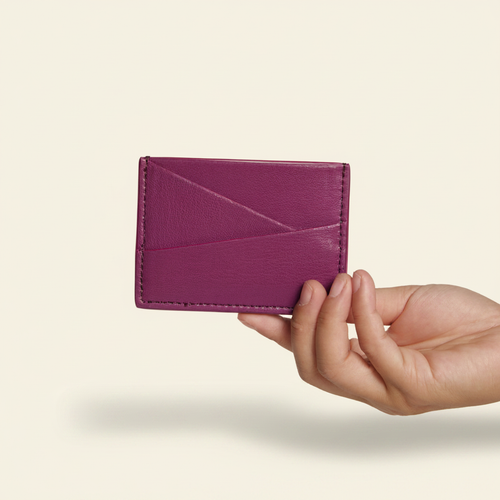 Gala Puzzle Cardholder Wild Berry model with natural shadow on warm ivory background