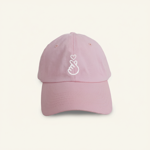 Love Hat (Youth) on clean warm ivory background, zero shadows — CULTR editorial product photo