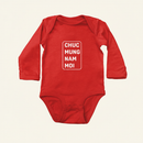 Lunar New Year Greeting Long Sleeve Onesies flat lay on clean warm ivory background, zero shadows — CULTR editorial product photo