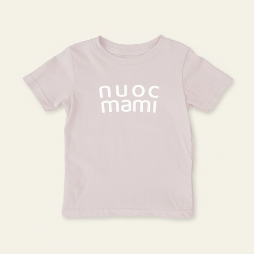 nuoc mami Shirt (Toddler) flat lay on clean warm ivory background, zero shadows — CULTR editorial product photo