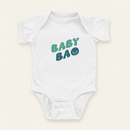 Baby Bao Onesie flat lay on clean warm ivory background, zero shadows — CULTR editorial product photo