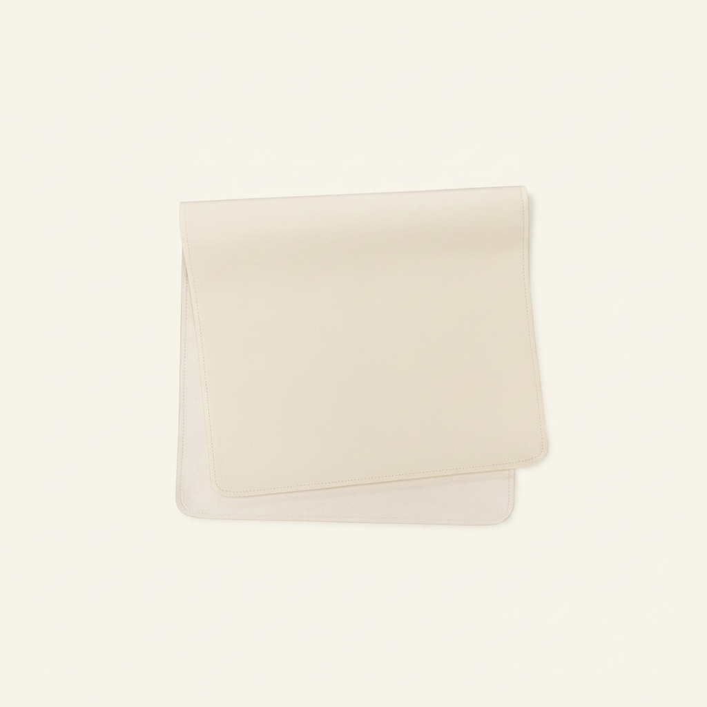 Vegan Leather Changing Mat Cream on clean warm ivory background, zero shadows — CULTR editorial product photo