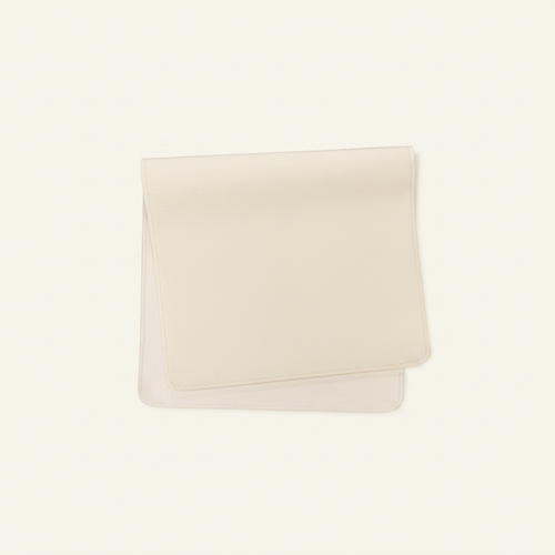 Vegan Leather Changing Mat Cream on clean warm ivory background, zero shadows — CULTR editorial product photo