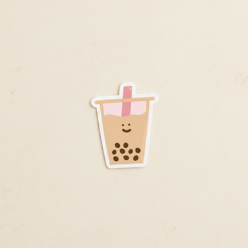 Boba Vinyl Sticker on warm ivory surface with soft diffused natural light — CULTR editorial product photo