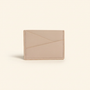 Gala Puzzle Cardholder Light Pink model with natural shadow on warm ivory background