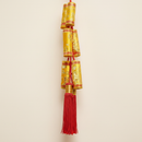 Lunar New Year Firecracker Hanging Gold on clean warm ivory background, zero shadows — Bo & Mei editorial product photo