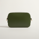 Cactus Crossbody Camera Bag model with natural ground shadow on warm ivory background