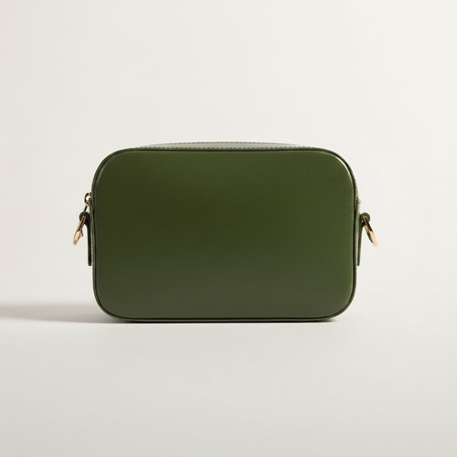 Cactus Crossbody Camera Bag model with natural ground shadow on warm ivory background