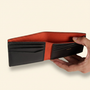 Gala Bifold Wallet Black model with natural ground shadow on warm ivory background