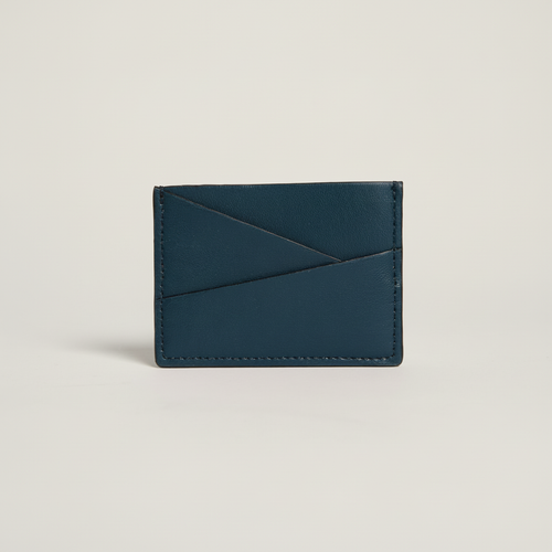 Gala Puzzle Cardholder (Navy) on clean warm ivory background, zero shadows, no logos — CULTR editorial product photo