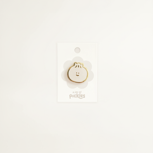 Bao Dumpling Pin on clean warm ivory background with flat ambient light — CULTR editorial product photo