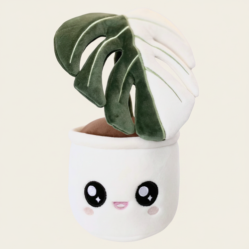 Monstera Deliciosa Albo Variegata Plushie on clean warm ivory background, zero shadows — Blushiez editorial product photo