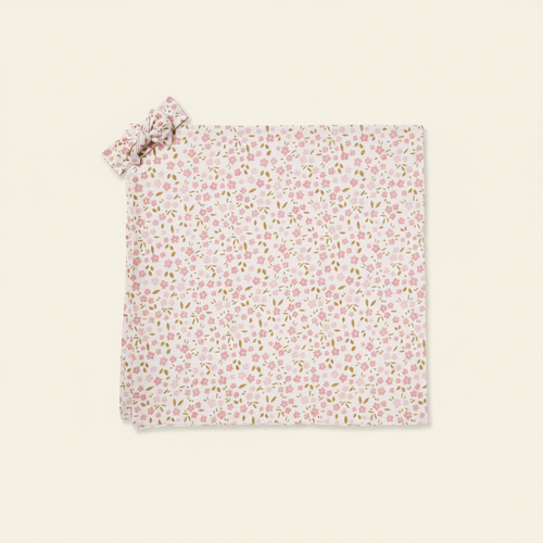 Swaddle Set flat lay on clean warm ivory background, zero shadows — CULTR editorial product photo