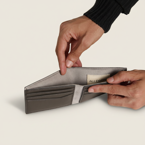 Pineapple Bifold Wallet Storm Grey model with natural shadow on warm ivory background