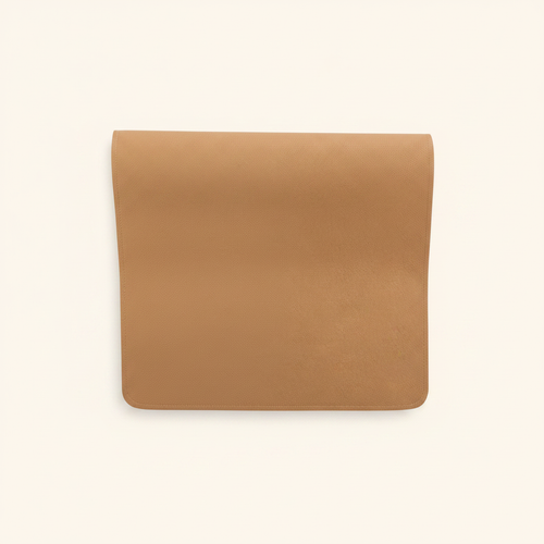 Vegan Leather Changing Mat Tan on clean warm ivory background, zero shadows — CULTR editorial product photo