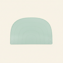 Rainbow Placemat on clean warm ivory background, zero shadows — CULTR editorial product photo