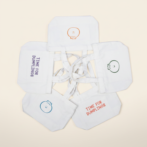 Bao Dumpling Mini Tote on warm ivory background