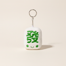 Fat Choy Fa Cai Green Dragon Plush Keychain on clean warm ivory background, zero shadows — Bo & Mei editorial product photo