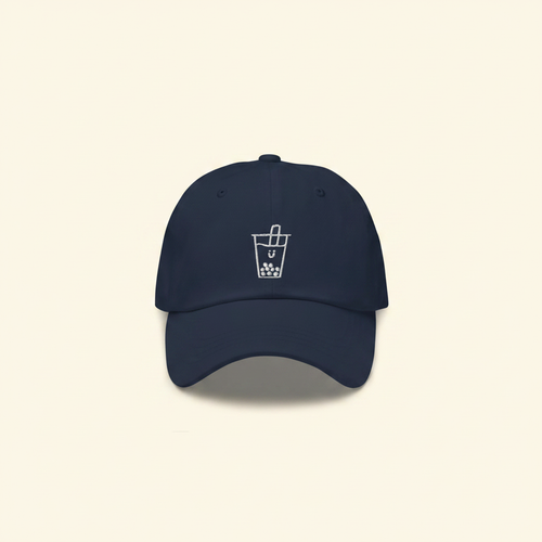 Boba Kids Embroidered Baseball Cap on clean warm ivory background with flat ambient light — CULTR editorial product photo