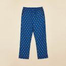 Adult Unisex Pajama Pants – Blue Diya horizontal flat lay on clean warm ivory background, zero shadows — CULTR editorial product photo