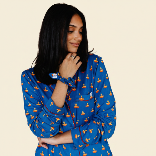 Adult Long Sleeve Button-Down Top – Blue Diya with model on ivory background
