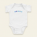 Bun Bo Bae Onesie flat lay on clean warm ivory background, zero shadows — CULTR editorial product photo