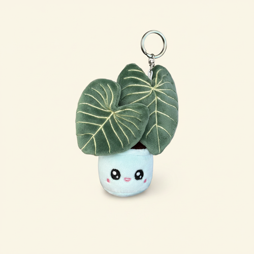 Philodendron Gloriosum Plush Keychain on clean warm ivory background, zero shadows — Blushiez editorial product photo