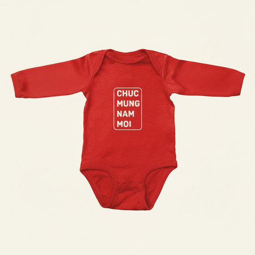 Lunar New Year Greeting Long Sleeve Onesies flat lay on clean warm ivory background, zero shadows — CULTR editorial product photo